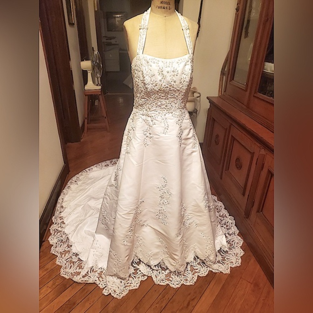 New with tags, Wedding Gown David’s Bridal, bustle was added.